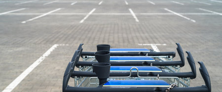 SHOPPING CART - Vehicle for shopping in a supermarket parking lotの写真素材