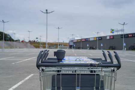 KOLOBRZEG, WEST POMERANIAN - POLAND - JULY 30, 2023: Shipping cart in the supermarket parking lotのeditorial素材
