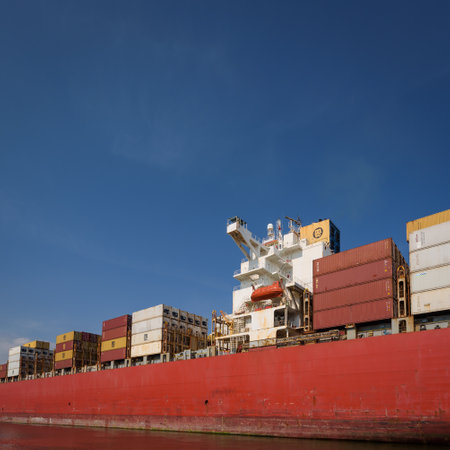 GDYNIA, POMERANIAN REGION - AUGUST 08, 2023: Container ship sails with cargo to the portのeditorial素材