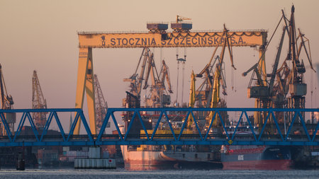 SZCZECIN, WEST POMERANIAN / POLAMD - 2020: The shipyard overhead crane and cranes above slipways for ship repair and constructionのeditorial素材