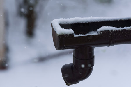 WINTER - Snow on the gutter of the building