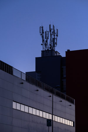 TELECOMMUNICATIONS NETWORK - GSM system transmitter antennas on the roof of the buildingの写真素材