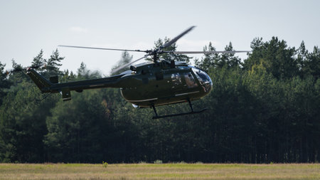 HELICOPTER - Machine against the background of forest and sky