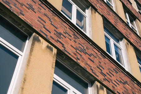 ARCHITECTURE - Brick wall and windows of an old modernist buildingの写真素材