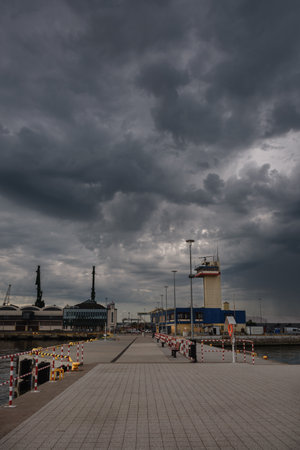 GDYNIA, POMERANIAN REGION - POLAND - MAY 27, 2024: Dramatic rain clouds over sea portのeditorial素材