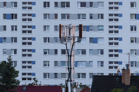 TELECOMMUNICATIONS NETWORK - GSM system transmitter antennas against the background of a residential...