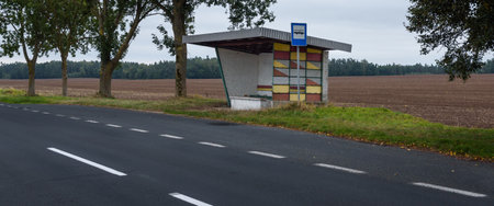 BUS STOP IN THE VILLAGE - Passenger shelter by the roadの写真素材