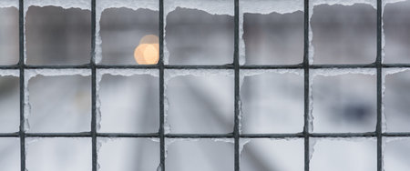 WINTER - Ice on a steel gridの写真素材