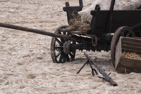 HORSE DRAWN WAGON - An old World War II refugee vehicle on the sea beachの写真素材