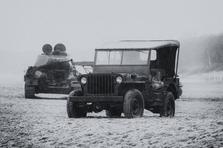 MILITARY VEHICLES - American vehicle and Soviet tank the period of World War II on the sea beach