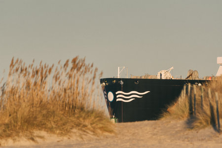 MARITIME TRANSPORT - The ship and the dunes of sea coastの写真素材