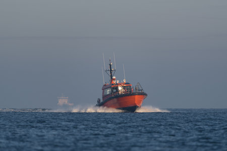 MARITIME TRANSPORT - A pilot boat sails on the seaの写真素材