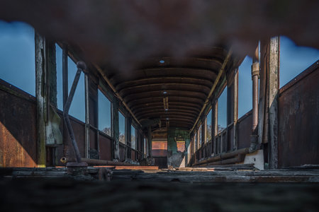NARROW GAUGE DIESEL RAILCAR - The interior of an old, rusty wreck of a passenger transport vehicle