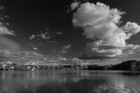 SUMMERTIME IN THE CITY OF CZAPLIENK - Beautiful lake landscape with cumulus clouds against a blue skyの写真素材
