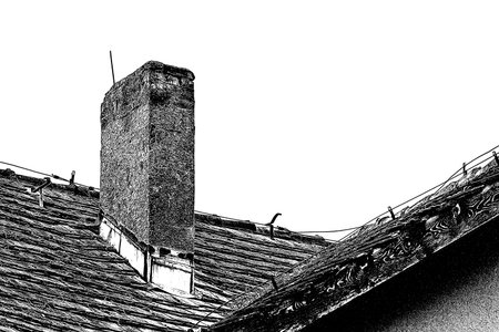 CHIMNEY ON THE ROOF - Brick architectural element of an old houseの写真素材
