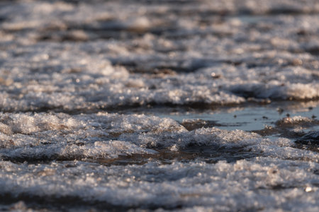 WINTER ON THE SEA COAST - Seawater and ice on the shorelineの写真素材