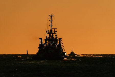 MARITIME TRANSPORT - The tugboat heads out to sea