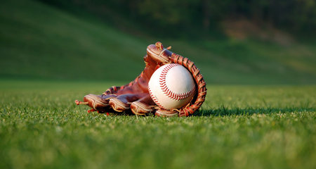 Baseball glove on the fieldの写真素材