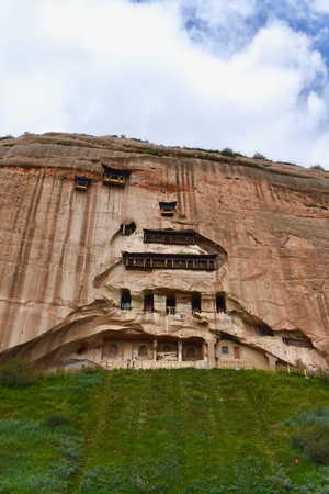 Hanging Mati Si temple with cloudy sky in the background in Gansu province, Chinaの写真素材
