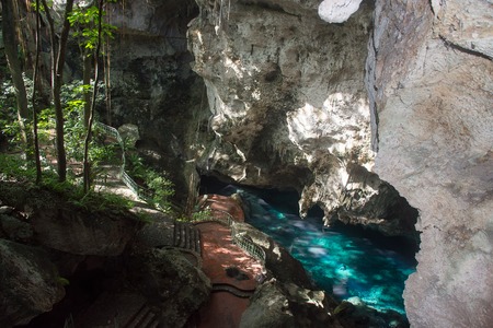 Beautiful blue lake is in a mountain deep caveの写真素材