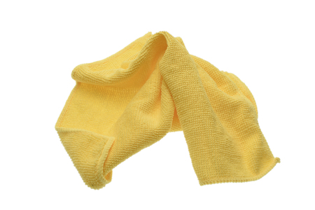 Yellow crumpled towel isolated on white background.の写真素材
