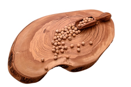 Chickpeas on wooden board isolated on white background.の写真素材