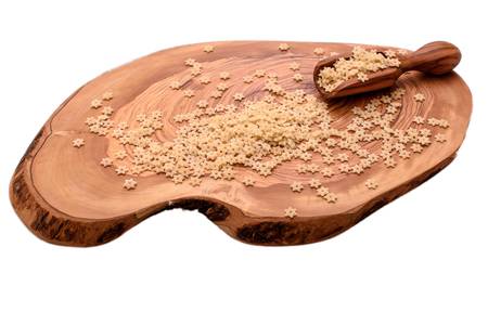 Macaroni on a wooden board of olive tree isolated on a white background.の写真素材