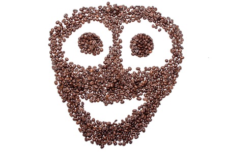 Cheerful smiley from coffee beans, isolated on white background.の写真素材