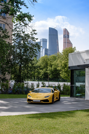 RUSSIA, MOSCOW - June 30, 2017: Lamborghini auto show against the backdrop of city skyscrapers of Moscow and the blue sky.のeditorial素材