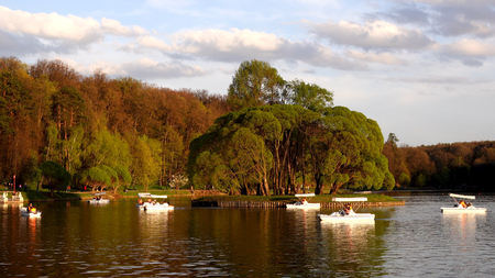 Beautiful view of the lake with boats and catamarans in the park Tsaritsynoの写真素材