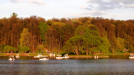 Beautiful view of the lake with boats and catamarans in the park Tsaritsynoの写真素材