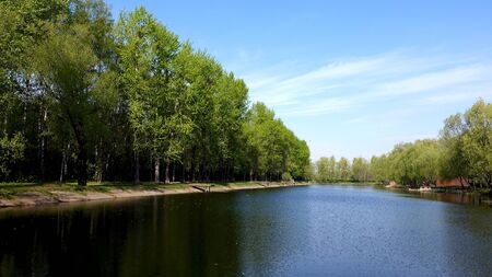 Beautiful clean European park with a beautiful view of the lakeの写真素材