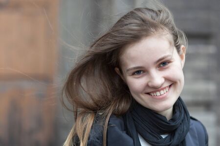 Charming smiling woman waving her hairの写真素材