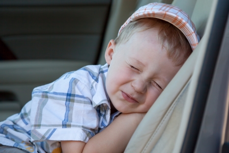 Sleeping baby in car seatの写真素材