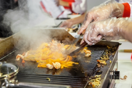 Cooking chicken and vegetables in steam tableの写真素材