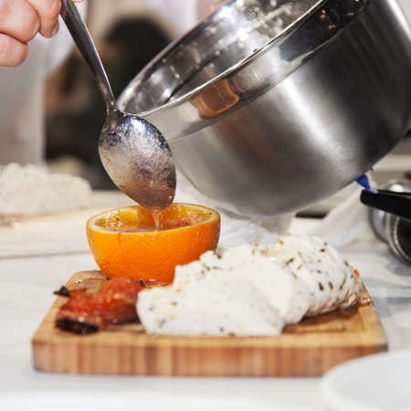 Cook the sauce poured into the empty orangeの写真素材