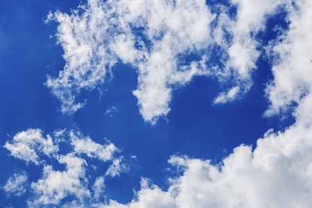 Photo of blue sky with beautiful white cloudsの写真素材