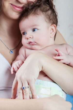 Portrait of infant in her arms momsの写真素材