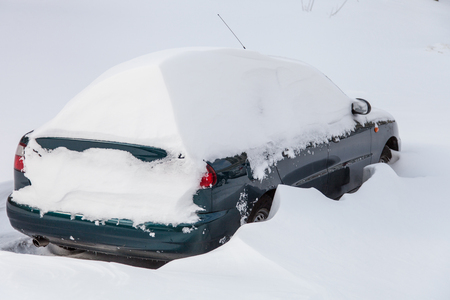 Cars covered in snow after a blizzardの写真素材