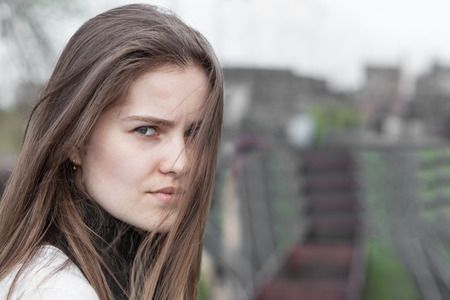 Closeup portrait pretty young woman outdoors