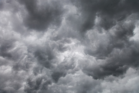 Dark ominous grey storm clouds. Dramatic sky
