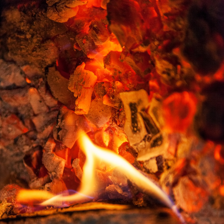 Decaying coals for cooking and a background