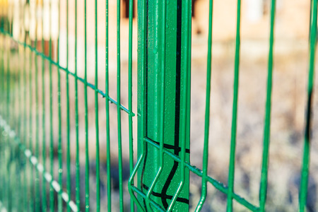 Fragment of the fence is covered with dew drops, close-up, outdoorの写真素材