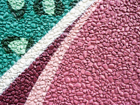 Multicolored stones. The wall is painted in different colors in texture style. Grunge backgroundの写真素材
