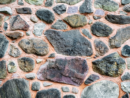 Stone wall as background or texture. Part of stone wall,as background or textureの写真素材