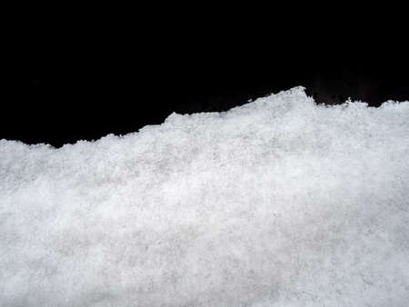 Snow cover on dark glass, abstract natural backgroundの写真素材