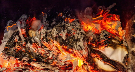 Burning paper in the fireplace, fire and ash