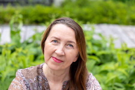 Close-up portrait of an adult woman outdoorsの写真素材