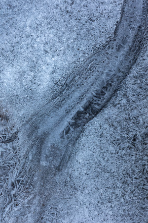 Texture ice surface of a mountain river close upの写真素材