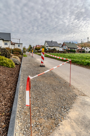Repair of the carriageway of the rural road, signal tapeの写真素材